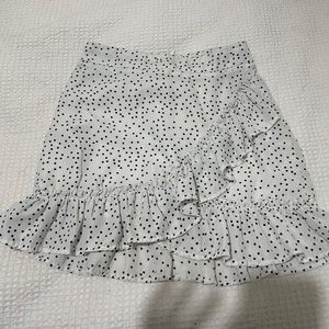 White ruffle skirt with black polka dots
